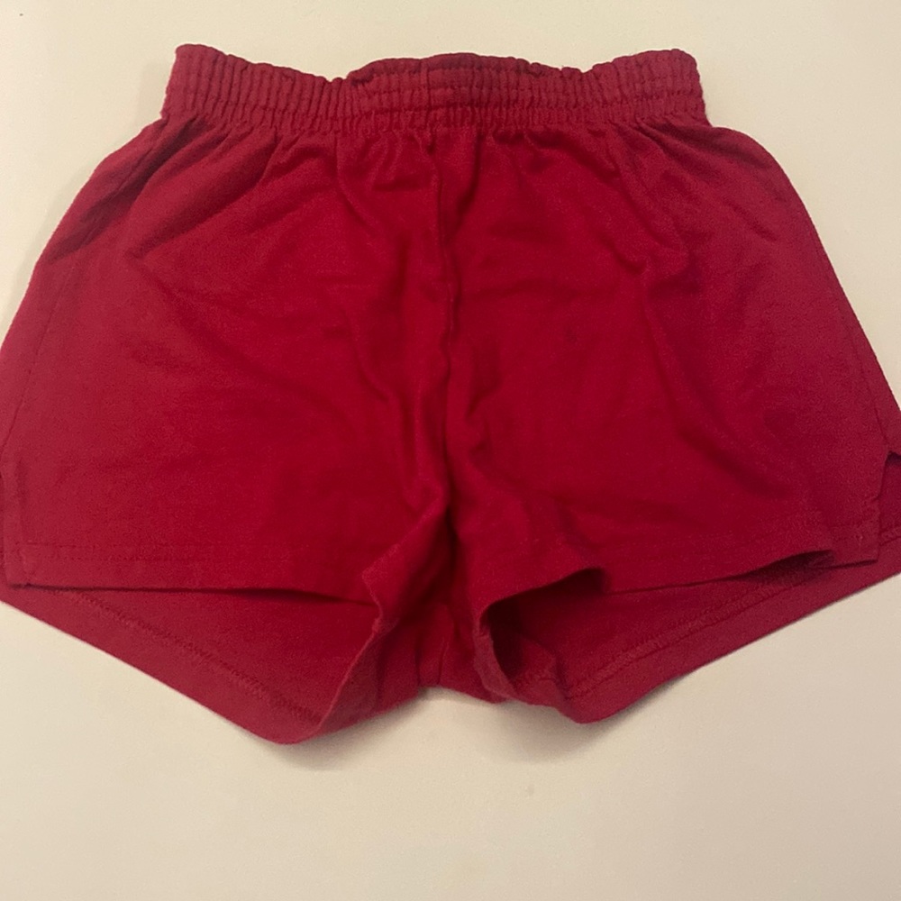 50% polyester. 50% cotton pink short